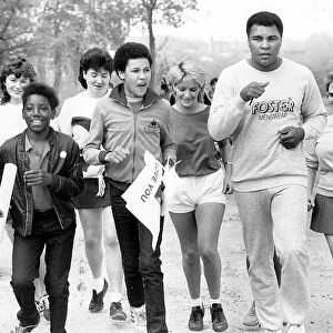 Muhammad Ali goes for a run around Edgbaston Reservoir with students from Edgbaston