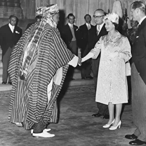 Queen Elizabeth II shakes hands with Alhaji Hon. Isa Kaita