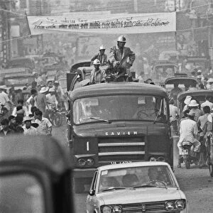 South Vietnamese fire service trying to make their way through the congested streets of