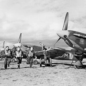 Spitfire fighter planes and men of the Bombay Squadron who have taken part in fighter