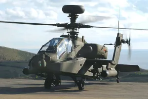 A British Army WAH-64 Apache attack helicopter prior to firing its underslung 30mm cannon A British Army WAH-64 Apache attack helicopter prior to firing its underslung 30mm cannon