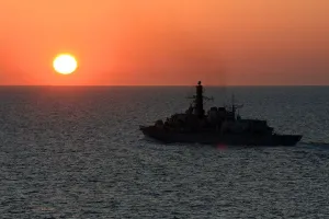 HMS Iron Duke sails into the sunset after saluting the island of Jersey HMS Iron Duke sails into the sunset after saluting the island of Jersey